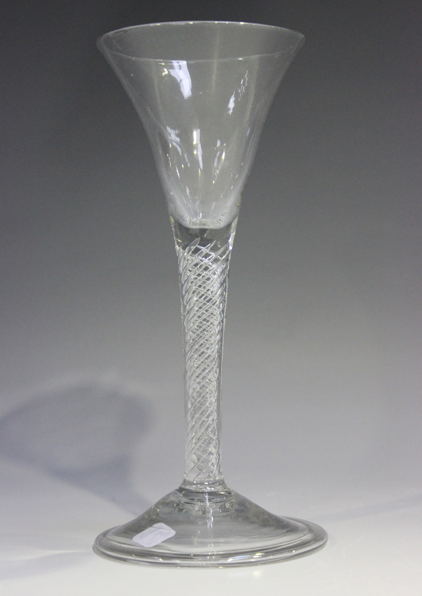 An airtwist stem wine glass, mid-18th century, the trumpet bowl raised on a plain multi-series