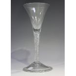 An airtwist stem wine glass, mid-18th century, the trumpet bowl raised on a plain multi-series