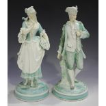 A pair of Continental porcelain figures of a lady and gallant, mid-19th century, decorated in shades