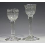 A plain stem wine glass, mid-18th century, the basal fluted ogee bowl engraved with a foliate