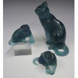 A Daum pâte-de-verre turquoise glass model of a cat, 20th century, seated with one paw raised,