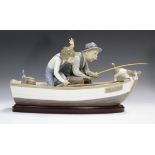 A large Lladro figure group Fishing with Gramps, model No. 5215, length 39cm, with wood stand.