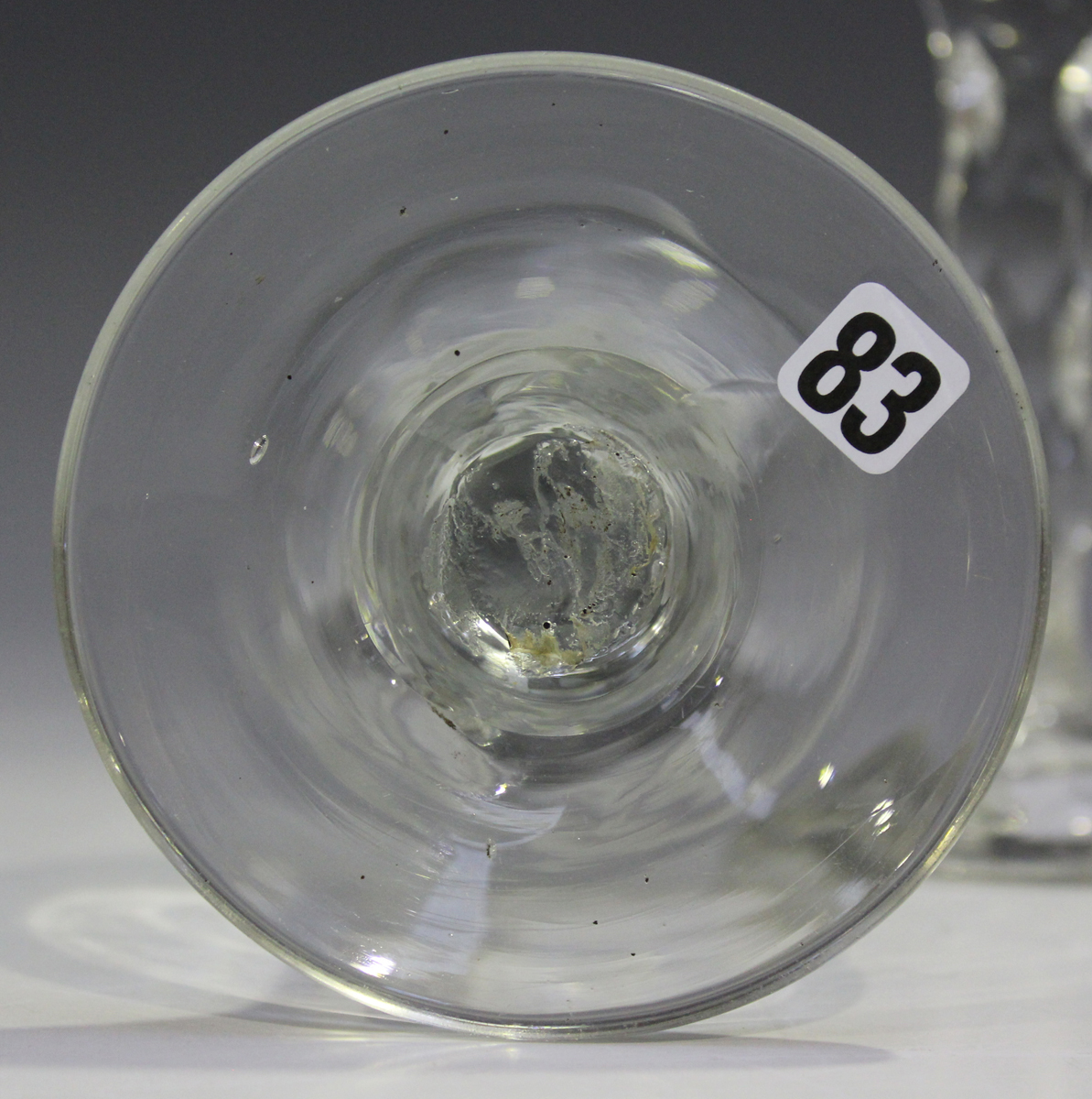 A faceted stem engraved glass, late 18th century, the lipped ogee bowl engraved with flowers and - Image 2 of 3