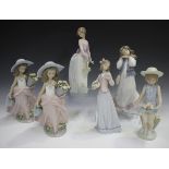 Six Lladro porcelain figures, comprising two A Wish Come True, No. 7676, Innocence in Bloom, No.