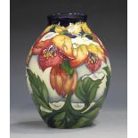 A Moorcroft Christmas Hellebore pattern vase, circa 2008, designed by Rachel Bishop, height 13.