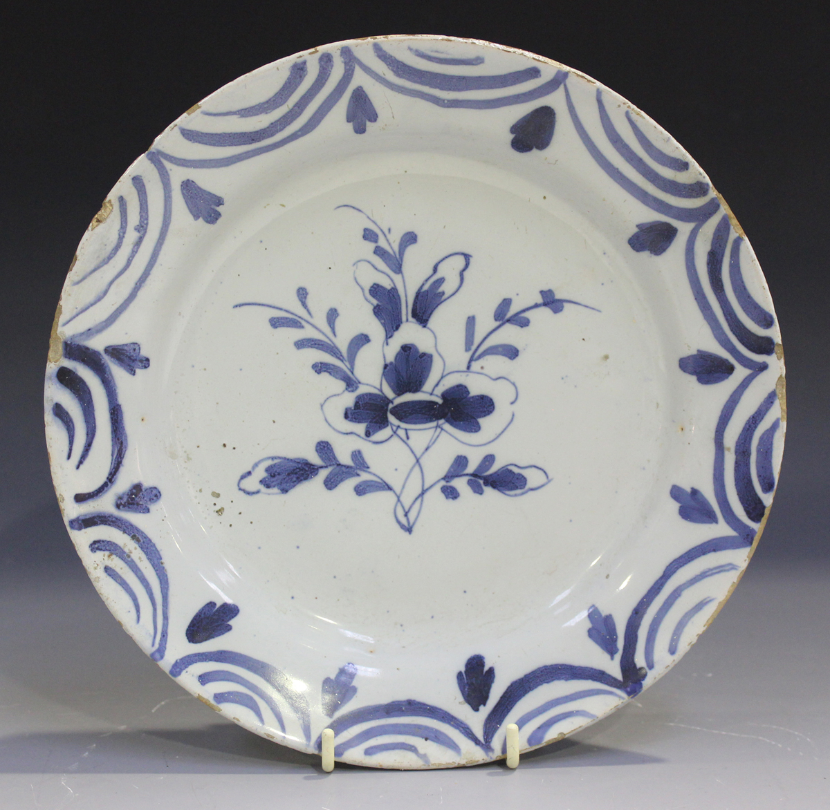 A naïve English Delft plate, probably London or Bristol, mid-18th century, of 'pancake' form, - Image 3 of 7