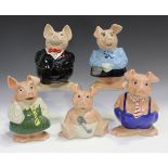 A family of five Wade NatWest pigs, each with black bung to base.Buyer’s Premium 29.4% (including