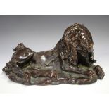 A treacle glazed terracotta model of a recumbent lion, late 19th/20th century, unmarked, length
