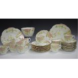A Wileman & Co Foley China aesthetic decorated part service, circa 1900, comprising two cake plates,