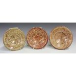 Three small Hispano-Moresque lustre pottery dishes, probably 18th century, two painted with a