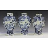 Three De Porcelyne Bijl Dutch Delft vases, 18th century, of baluster shape, each painted in blue