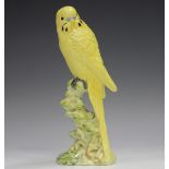 A Beswick yellow budgerigar, No. 1216B, height 17.8cm.Buyer’s Premium 29.4% (including VAT @ 20%) of