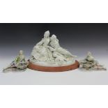 A pair of Meissen porcelain figures, late 19th century, modelled as a recumbent male and female,