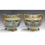 A pair of Royal Doulton stoneware cauldron shaped jardinières, early 20th century, decorated with