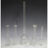Five glass toddy lifters, early 19th century, three with faceted detail, one of plain form with