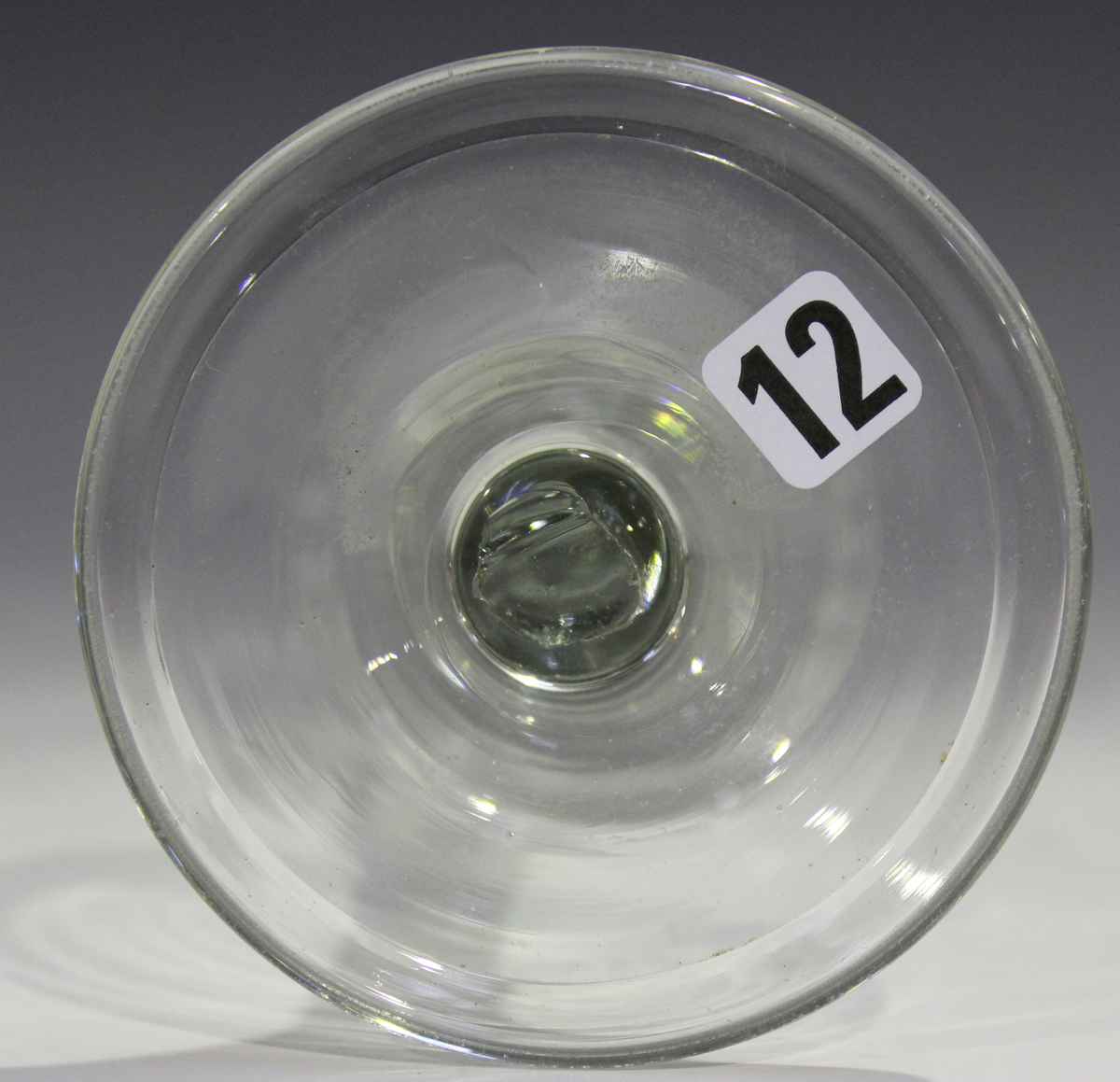 A plain stem wine glass, mid-18th century, the basal fluted ogee bowl engraved with a foliate - Image 2 of 3