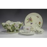 A Meissen porcelain teacup and matched saucer, early 20th century, painted with floral bouquets,