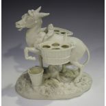 A Parian model of a donkey, late 19th century, standing on a naturalistic base, panniers on its