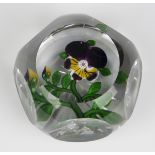 A Baccarat glass faceted pansy paperweight, circa 1850, the purple, yellow and white flower on a