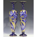 A pair of Thomas Forester & Sons flow blue and gilt vases, early 20th century, each slender body