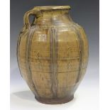 A Mike Dodd studio pottery stoneware vase, the ovoid body with applied vertical strapwork beneath