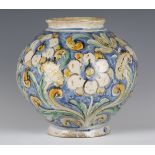 A Sicilian maiolica jar, 17th century, the bulbous body painted with white flowers and foliage in