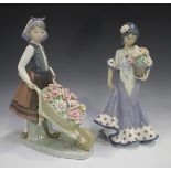 Two Lladro porcelain figures, comprising A Barrel of Blossoms, No. 1419, and Flora Maria, No. 5490.