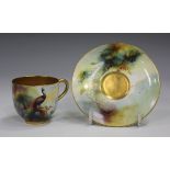 A Royal Worcester gilt-lined cabinet cup and saucer, circa 1910, painted by Austin, signed, with a