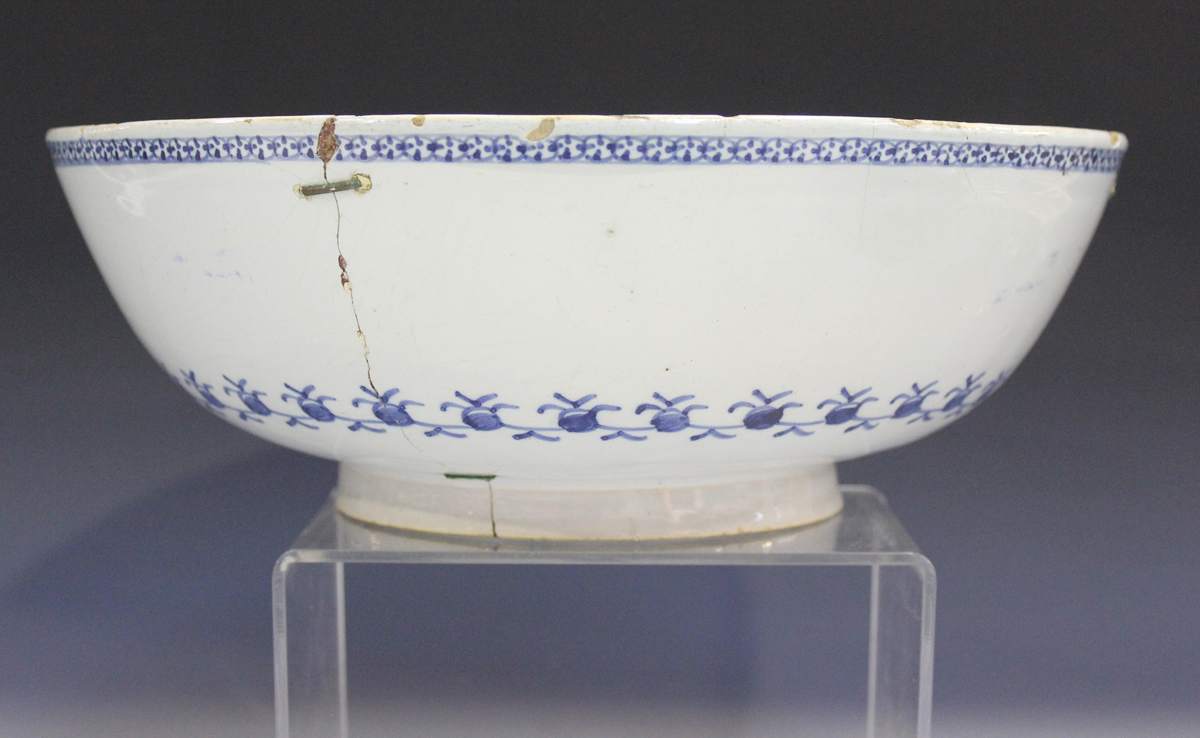 An English Delft circular bowl, London or Bristol, circa 1760, the exterior painted in manganese and - Image 4 of 14