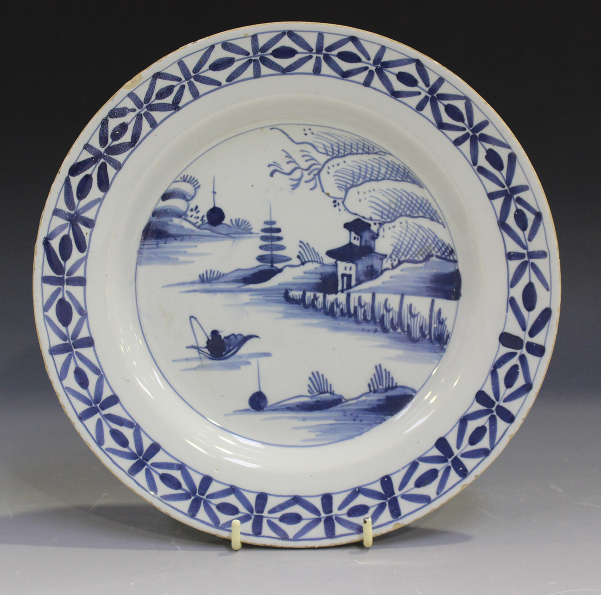 Three English Delft plates, mid-18th century, each painted in blue with a chinoiserie landscape - Image 3 of 7