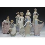 Eight Lladro figures, including Petals of Love, No. 6346, Girl with Lamb, No 4835, Girl with Pitcher