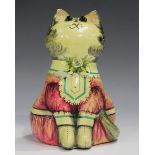 A Joan and David de Bethel Rye Pottery model of a seated cat, dated 1967, wearing a pink dress and