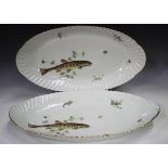 Two Limoges fish platters, 20th century, both decorated with a fish, crustaceans and weed within a