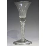 An airtwist stem wine glass, mid-18th century, the waisted bell shaped bowl raised on a plain