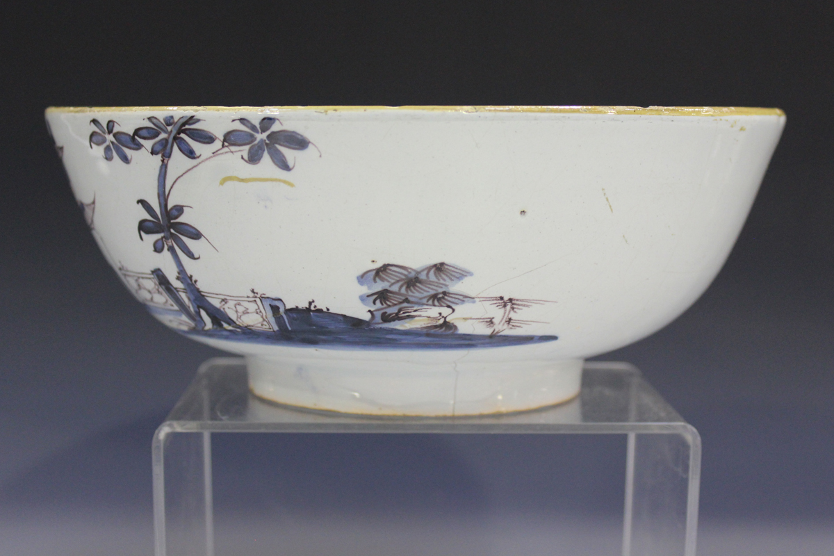 An English Delft circular bowl, London or Bristol, circa 1760, the exterior painted in manganese and - Image 13 of 14