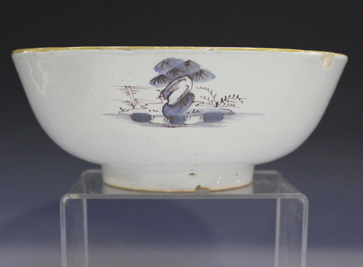 An English Delft circular bowl, London or Bristol, circa 1760, the exterior painted in manganese and - Image 12 of 14