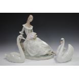 Two Lladro swans, Graceful Swan, No. 5230, and Swan with Wings Spread, No. 5231, together with a