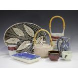 A collection of studio pottery, including a Mary Rich porcelain teapot with cane handle, the body