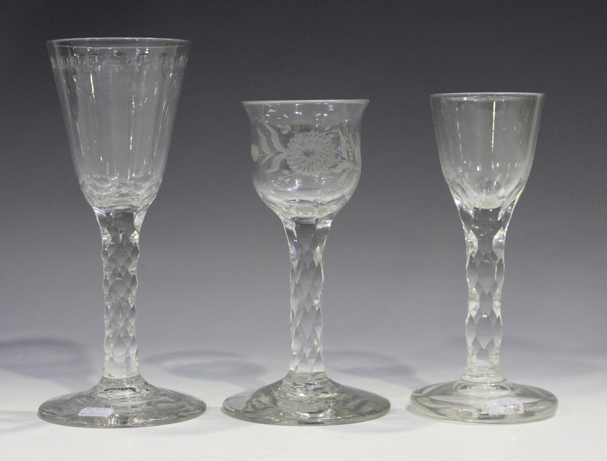 A faceted stem engraved glass, late 18th century, the lipped ogee bowl engraved with flowers and