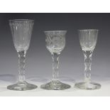 A faceted stem engraved glass, late 18th century, the lipped ogee bowl engraved with flowers and