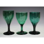 Three green glass wines, early 19th century, height of tallest 13cm, together with six other wines