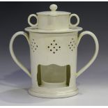 A creamware pottery veilleuse, 19th century, the two-handled cylindrical body with pierced