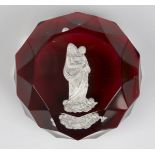 A Baccarat glass Madonna and Christ Child sulphide paperweight, circa 1850, set on a translucent