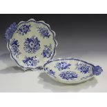 A pair of blue printed pearlware dishes, early 19th century, decorated with scattered flower