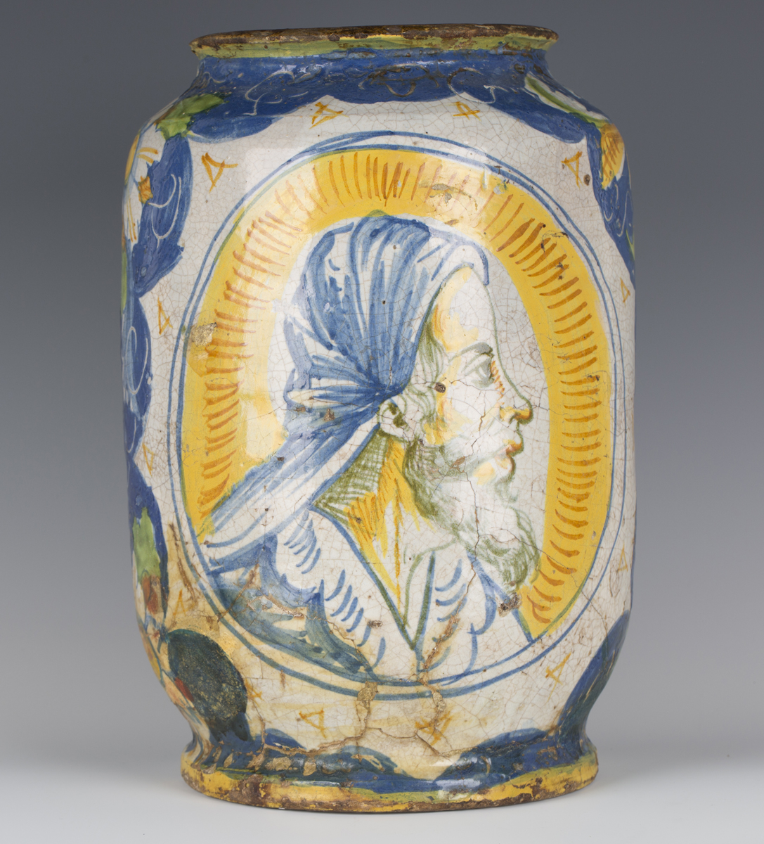 An Italian maiolica cylindrical storage or drug jar, Calabrian, 17th century, painted in the