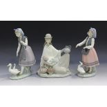 Three Lladro figures, comprising Peruvian Girl with Baby, No. 4822, and two Dutch girls with geese.