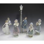 Five Lladro porcelain figures, comprising Lamplighter, No. 5205, Now and Forever, No. 7642, both