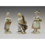 A Meissen porcelain figure of a female musician playing a cello, late 18th century, modelled