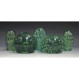 Nine soda glass dump paperweights, 19th century, each with internal bubble decoration, height of
