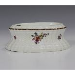 A Meissen oval shaped salt, late 18th century, the basketweave moulded body painted with scattered